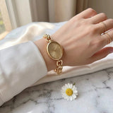 Lady's Steel Strap Watch Gold Oval Hollow Chain Quartz Watch